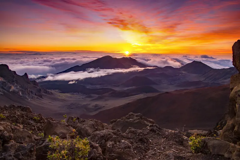 Sunrise over the clouds from the summit of Haleakalā, Maui