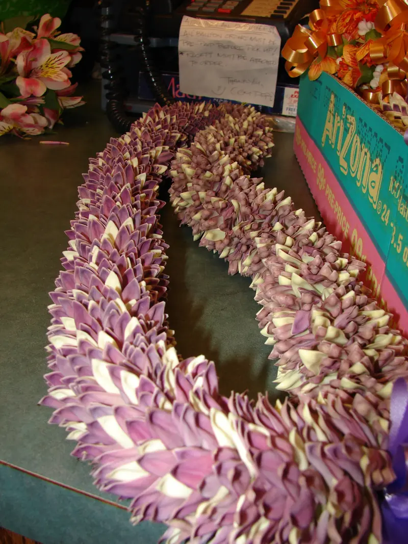 A lei of lavender crown flowers for sale on Maui